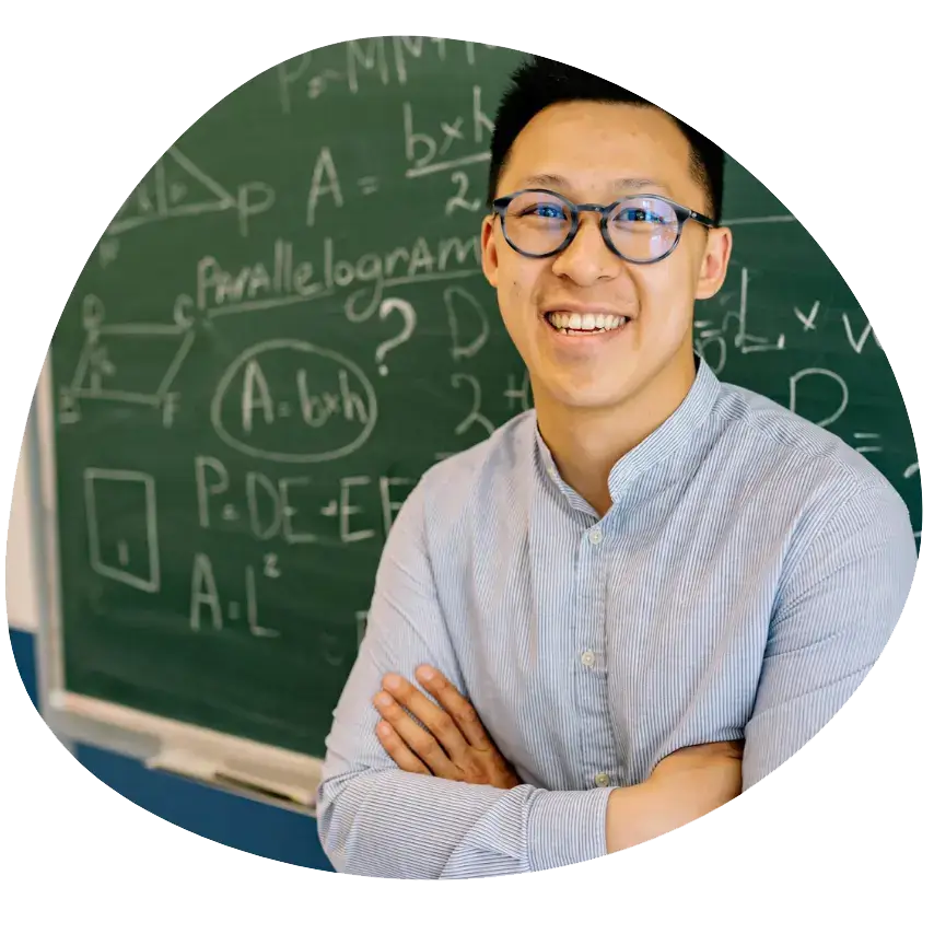 Teaching Assistant Apprenticeship: Teaching Assistant Apprentice: a man standing in front of a chalkboard