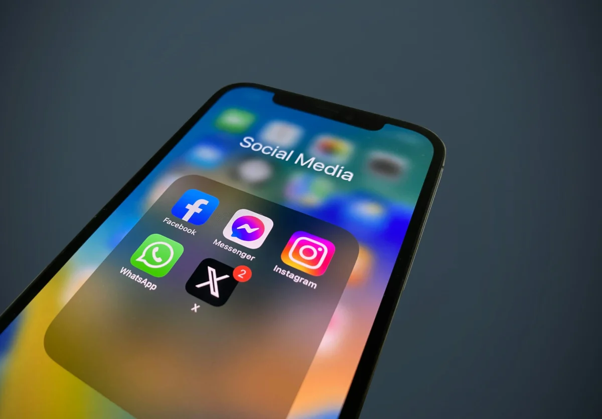 Photo of phone with social media apps, Embedding British Values in the Digital Age: Promoting Respect and Etiquette Online and in the Workplace.